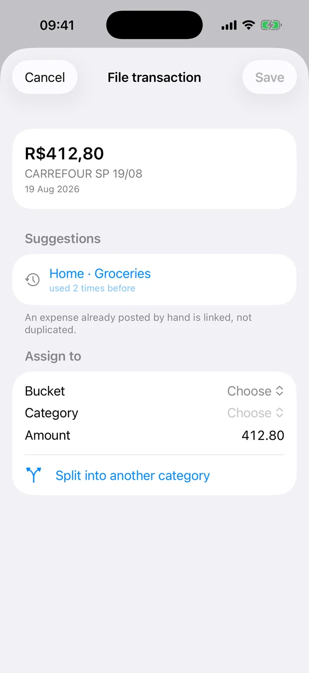 Filing a transaction, showing suggestions from spending history and a split across two categories.